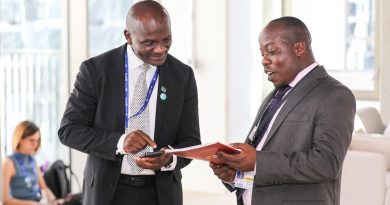 Amos Wemanya (Right) the Lead, Just Transitions at Power Shift Africa, presenting a copy the civil society statement on renewable energy targets for Africa to Ephraim Shitima, Chair, Africa Group of Negotiators